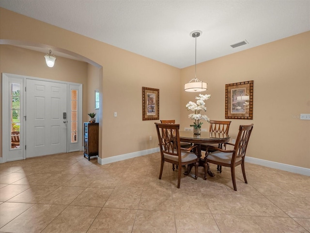 27546 Stonecreek Way, Wesley Chapel, FL 33544 - dining room with arched walkways and light tile patterned floors