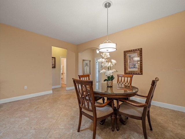 27546 Stonecreek Way, Wesley Chapel, FL 33544 - dining area with arched walkways and baseboards