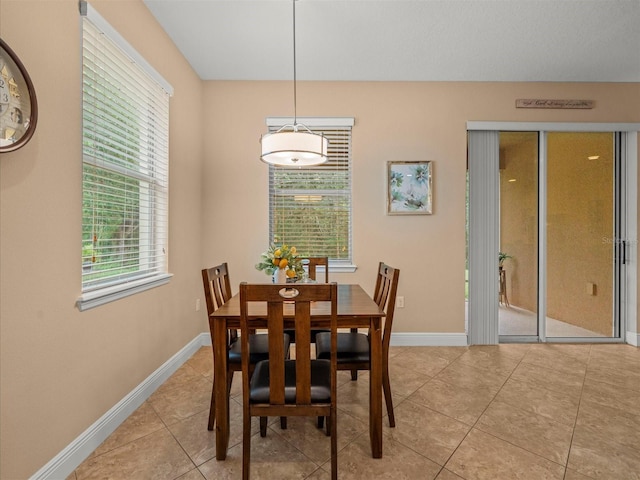 27546 Stonecreek Way, Wesley Chapel, FL 33544 - dining room with baseboards and light tile patterned floors