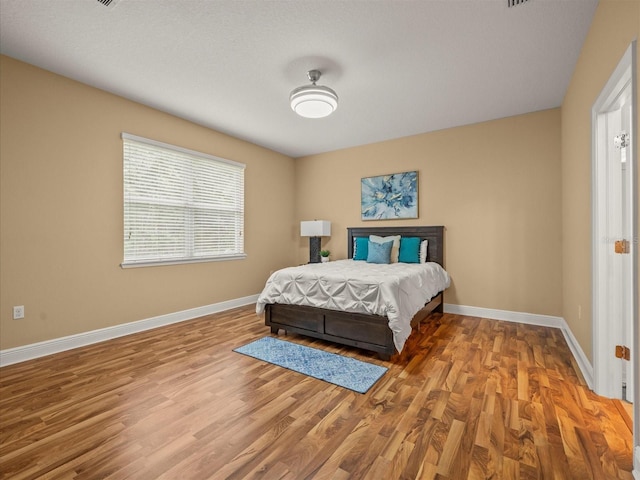 27546 Stonecreek Way, Wesley Chapel, FL 33544 - bedroom featuring wood finished floors