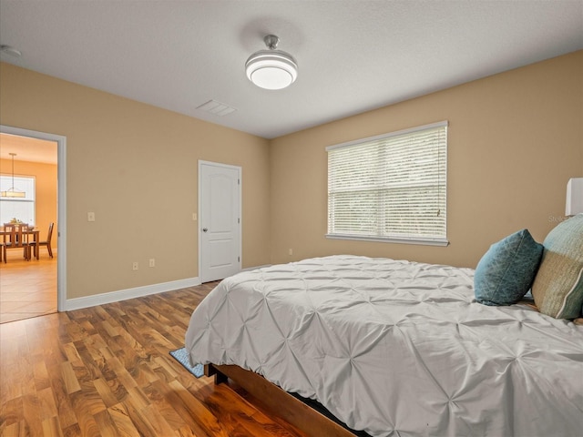 27546 Stonecreek Way, Wesley Chapel, FL 33544 - bedroom featuring wood finished floors and baseboards