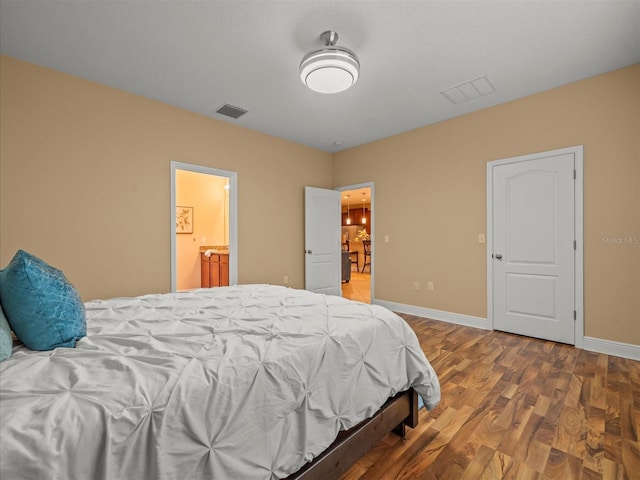 27546 Stonecreek Way, Wesley Chapel, FL 33544 - bedroom featuring wood finished floors and ensuite bath