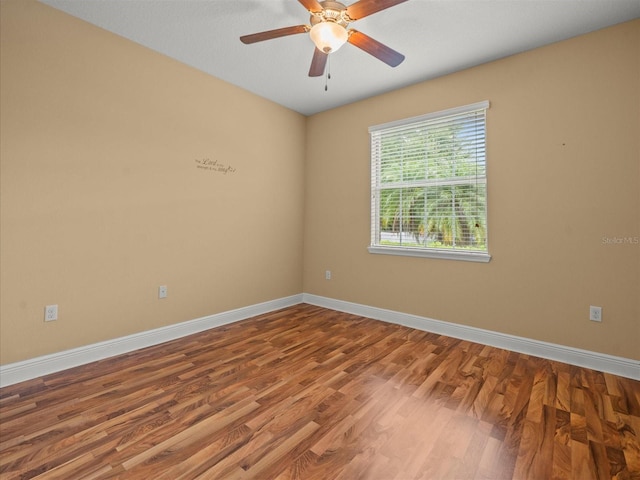 27546 Stonecreek Way, Wesley Chapel, FL 33544 - spare room with wood finished floors and a ceiling fan