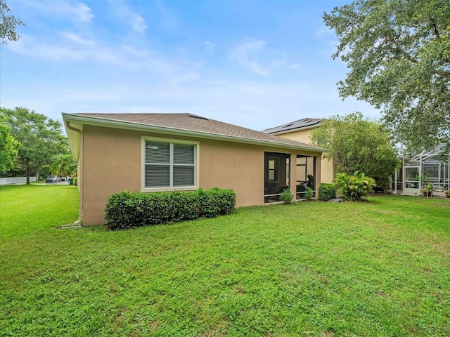 27546 Stonecreek Way, Wesley Chapel, FL 33544 - back of house featuring stucco siding and a yard
