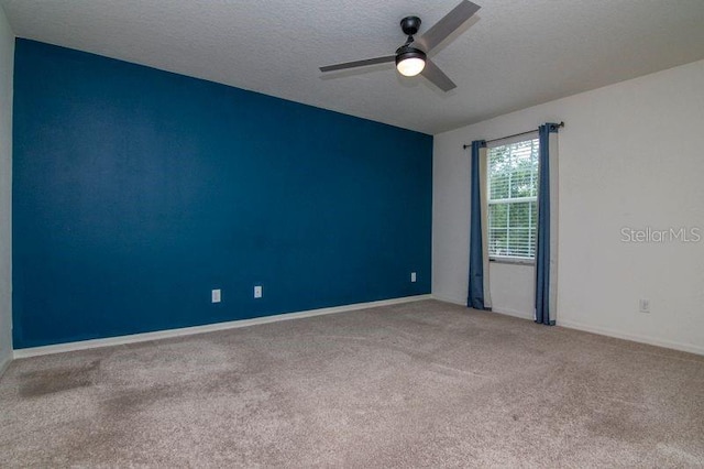 5916 Tulip Flower Dr, Riverview, FL 33578 - empty room featuring carpet, ceiling fan, and a textured ceiling