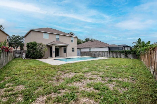 5916 Tulip Flower Dr, Riverview, FL 33578 - rear view of house featuring stucco siding, a fenced backyard, and a patio area