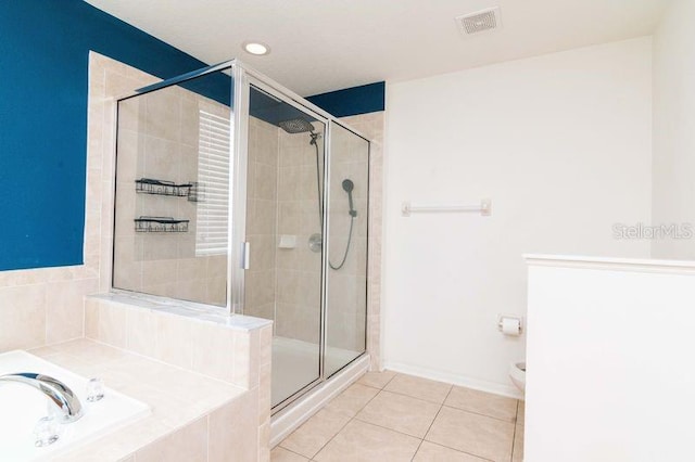 5916 Tulip Flower Dr, Riverview, FL 33578 - full bath with tile patterned flooring, a shower stall, a garden tub, and recessed lighting