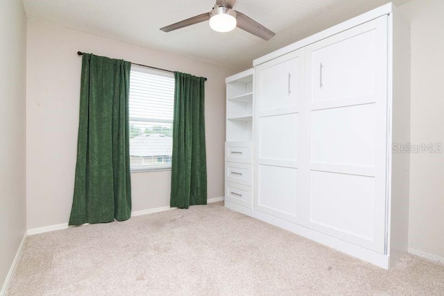 5916 Tulip Flower Dr, Riverview, FL 33578 - unfurnished bedroom featuring light carpet and a ceiling fan