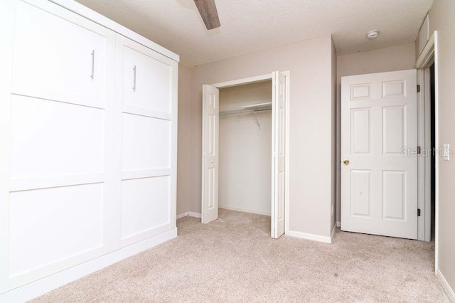 5916 Tulip Flower Dr, Riverview, FL 33578 - unfurnished bedroom featuring light colored carpet, a ceiling fan, and a closet
