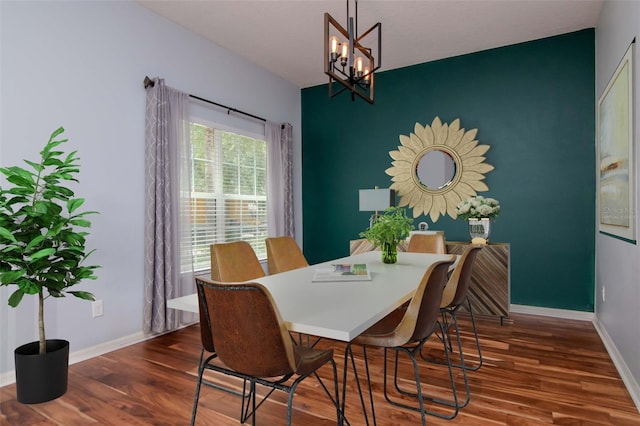 5916 Tulip Flower Dr, Riverview, FL 33578 - dining room featuring wood finished floors, a chandelier, and an accent wall