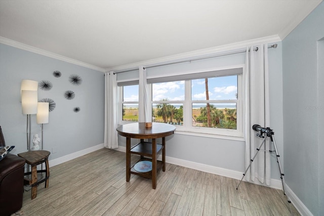 1230 Gulf Blvd Unit 304, Clearwater, FL 33767 - dining area with ornamental molding, light wood-type flooring, healthy amount of natural light, and baseboards