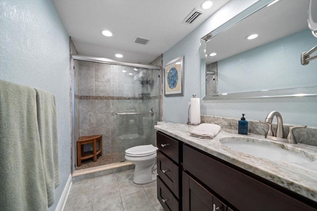 1230 Gulf Blvd Unit 304, Clearwater, FL 33767 - bathroom featuring toilet, vanity, a stall shower, tile patterned floors, and recessed lighting