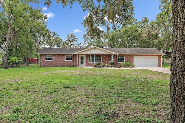 11029 Clay Pit Rd, Tampa, FL 33610 - single story home with a garage, concrete driveway, brick siding, and a front lawn