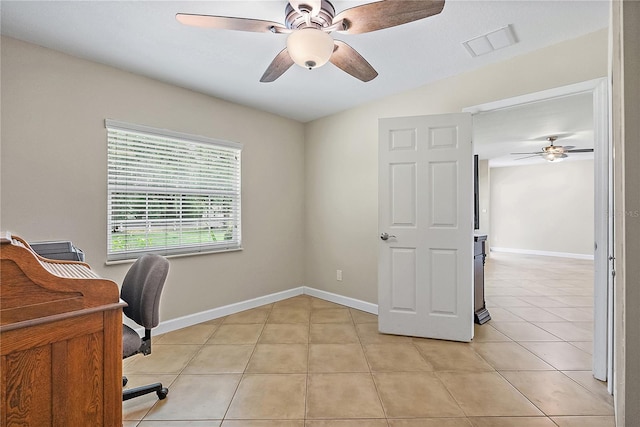 11029 Clay Pit Rd, Tampa, FL 33610 - office featuring ceiling fan, light tile patterned floors, and baseboards