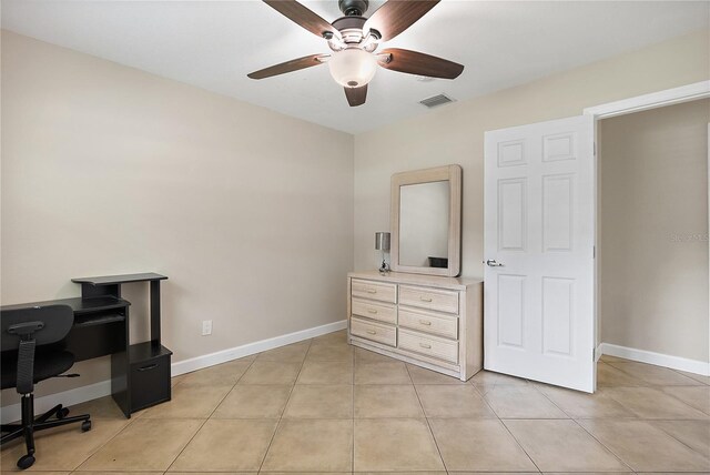 11029 Clay Pit Rd, Tampa, FL 33610 - home office with ceiling fan, baseboards, and light tile patterned floors