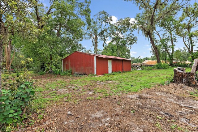 11029 Clay Pit Rd, Tampa, FL 33610 - view of yard featuring an outbuilding