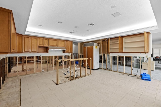333 Midway Is, Clearwater Beach, FL 33767 - misc room featuring a textured ceiling and a raised ceiling