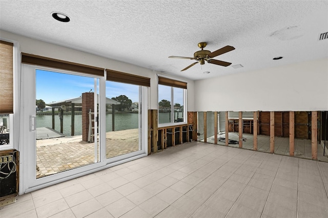 333 Midway Is, Clearwater Beach, FL 33767 - unfurnished sunroom with a water view