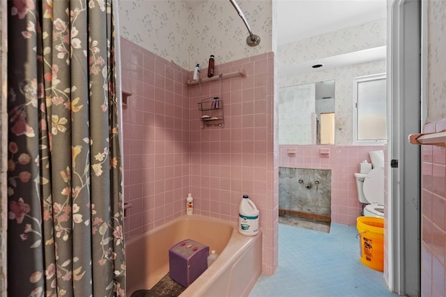 333 Midway Is, Clearwater Beach, FL 33767 - bathroom featuring tile walls, wallpapered walls, tile patterned flooring, shower / bath combination with curtain, and wainscoting