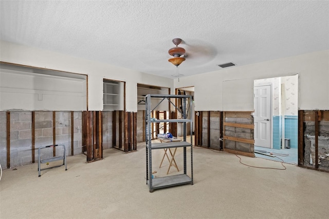 333 Midway Is, Clearwater Beach, FL 33767 - unfurnished bedroom featuring a textured ceiling and carpet floors