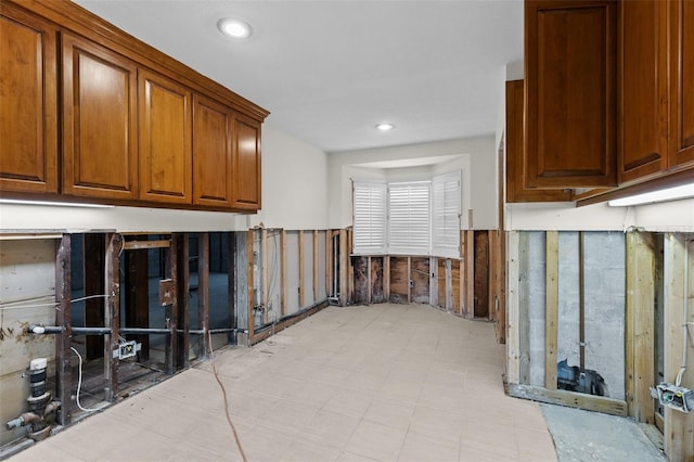 333 Midway Is, Clearwater Beach, FL 33767 - kitchen with recessed lighting, brown cabinetry, and light floors