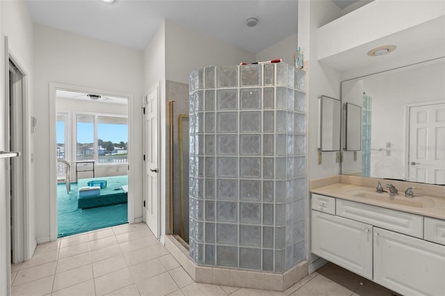 333 Midway Is, Clearwater Beach, FL 33767 - ensuite bathroom with a walk in shower, vanity, and tile patterned floors