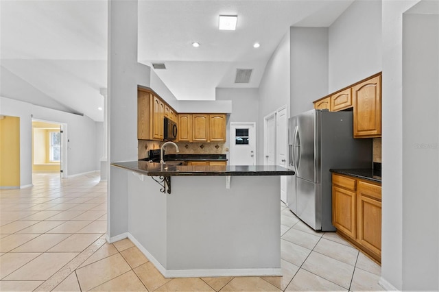 15123 Bald Eagle St, Tampa, FL 33625 - kitchen with black microwave, light tile patterned floors, a peninsula, tasteful backsplash, and high vaulted ceiling