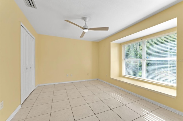 15123 Bald Eagle St, Tampa, FL 33625 - unfurnished bedroom with a closet, baseboards, and light tile patterned flooring
