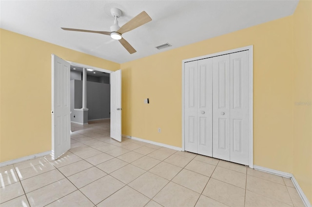 15123 Bald Eagle St, Tampa, FL 33625 - unfurnished bedroom featuring light tile patterned floors, baseboards, and a closet