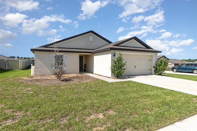 1741 Canaan Loop, Dundee, FL 33838 - ranch-style house with stucco siding, concrete driveway, and an attached garage