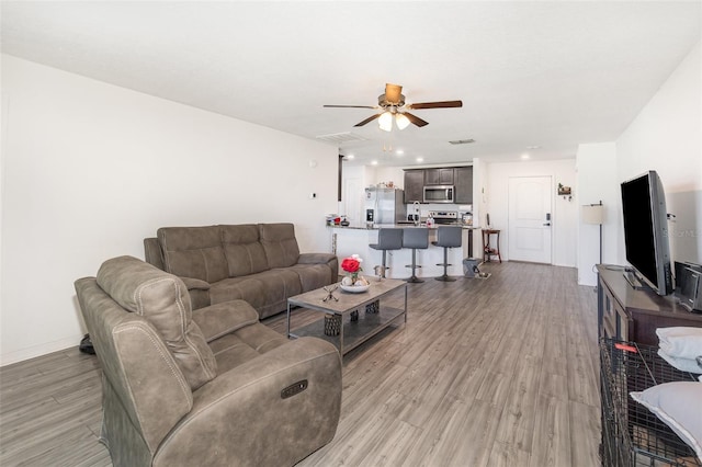 1741 Canaan Loop, Dundee, FL 33838 - living room featuring ceiling fan, light wood-style flooring, and recessed lighting