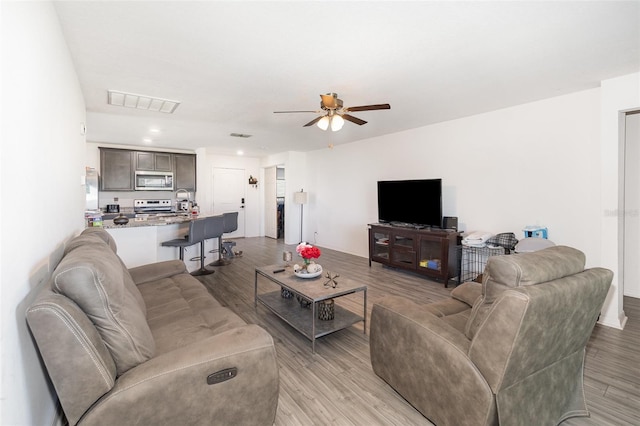 1741 Canaan Loop, Dundee, FL 33838 - living area with a ceiling fan, light wood-style floors, and recessed lighting
