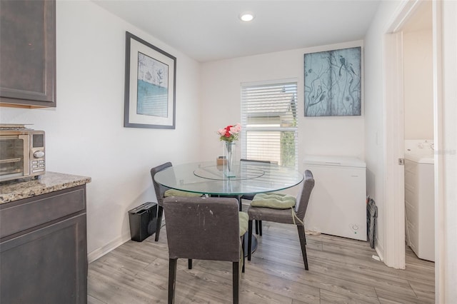 1741 Canaan Loop, Dundee, FL 33838 - dining room featuring light wood finished floors, washer / dryer, and recessed lighting
