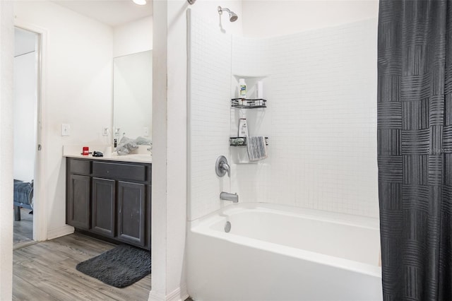 1741 Canaan Loop, Dundee, FL 33838 - full bathroom with shower / tub combo, wood finished floors, and vanity