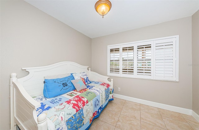 4450 Gulf Blvd Unit 110, St Pete Beach, FL 33706 - tiled bedroom featuring baseboards