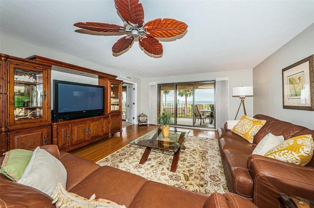 4450 Gulf Blvd Unit 110, St Pete Beach, FL 33706 - living room featuring wood finished floors and ceiling fan