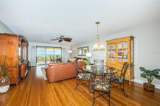 4450 Gulf Blvd Unit 110, St Pete Beach, FL 33706 - dining space with wood finished floors and ceiling fan