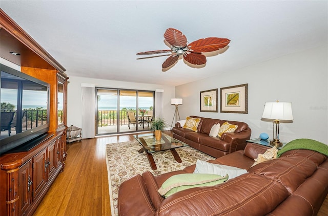 4450 Gulf Blvd Unit 110, St Pete Beach, FL 33706 - living area with ceiling fan and light wood-style flooring