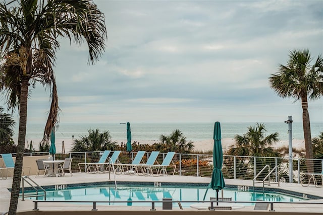 4450 Gulf Blvd Unit 110, St Pete Beach, FL 33706 - community pool with view of water and beach and a patio area