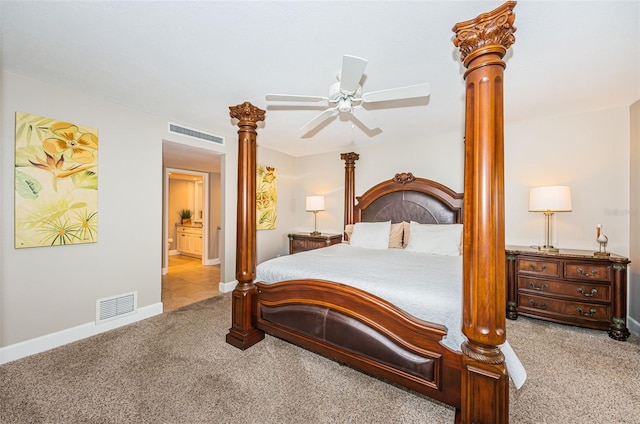 4450 Gulf Blvd Unit 110, St Pete Beach, FL 33706 - carpeted bedroom featuring ornate columns, ensuite bath, and ceiling fan