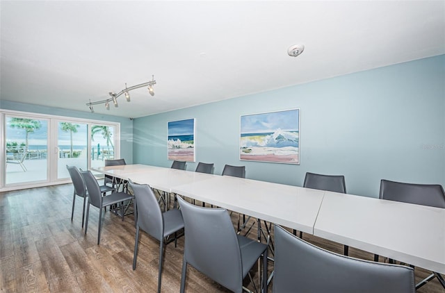 4450 Gulf Blvd Unit 110, St Pete Beach, FL 33706 - dining area with wood finished floors and rail lighting