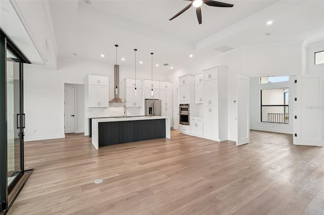 15218 Appleton Blvd, Port Charlotte, FL 33981 - kitchen featuring stainless steel appliances, wall chimney range hood, ceiling fan, white cabinets, and recessed lighting
