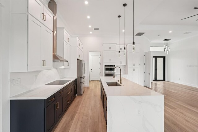 15218 Appleton Blvd, Port Charlotte, FL 33981 - kitchen with white cabinets, stainless steel appliances, light wood finished floors, and recessed lighting