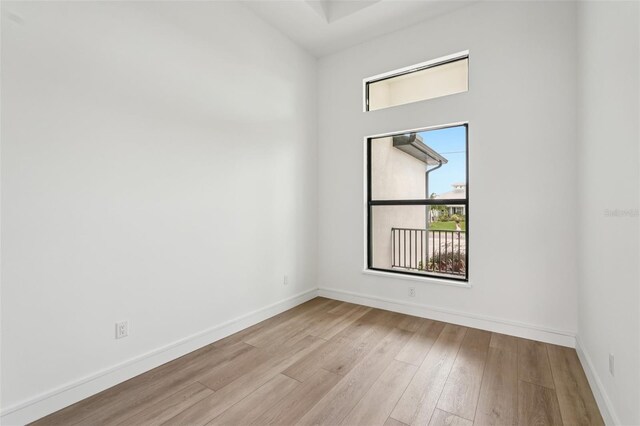 15218 Appleton Blvd, Port Charlotte, FL 33981 - empty room with wood finished floors and baseboards