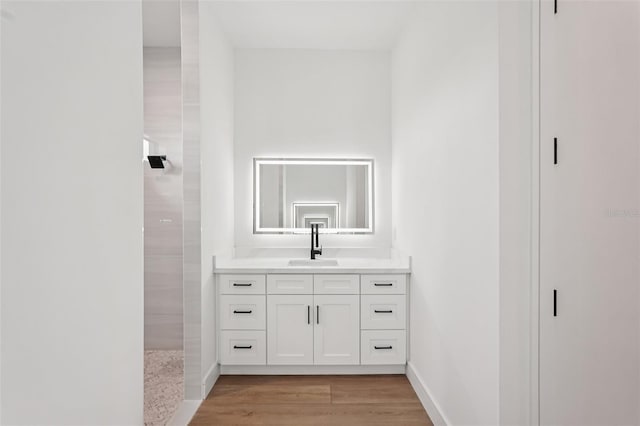 15218 Appleton Blvd, Port Charlotte, FL 33981 - full bathroom featuring vanity, a tile shower, and wood finished floors