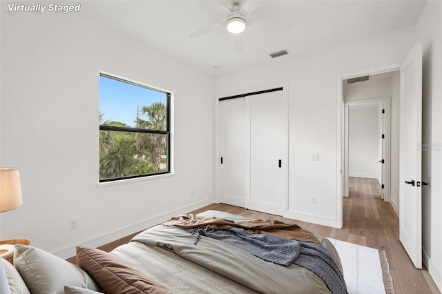 15218 Appleton Blvd, Port Charlotte, FL 33981 - bedroom featuring light wood-type flooring, a closet, and a ceiling fan