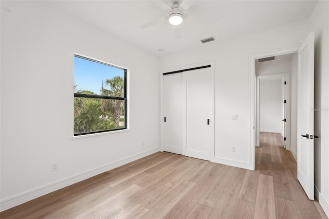 15218 Appleton Blvd, Port Charlotte, FL 33981 - unfurnished bedroom featuring light wood-style flooring, a closet, and a ceiling fan