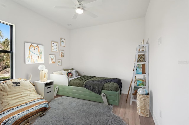 15218 Appleton Blvd, Port Charlotte, FL 33981 - bedroom with multiple windows, wood finished floors, and ceiling fan
