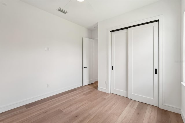 15218 Appleton Blvd, Port Charlotte, FL 33981 - unfurnished bedroom featuring light wood-style floors and a closet