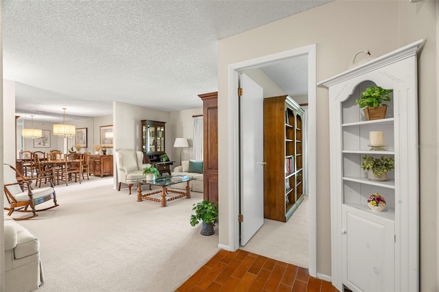 214 Caryl Way, Oldsmar, FL 34677 - hallway with a textured ceiling and dark colored carpet